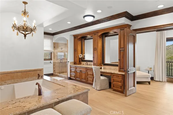 a living room with stainless steel appliances granite countertop furniture and a kitchen view