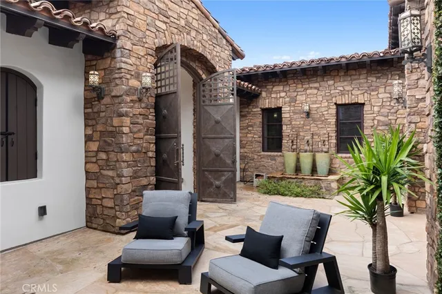 a view of backyard of house with outdoor seating