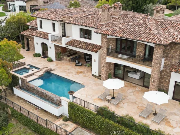 a view of house with outdoor space and sitting area