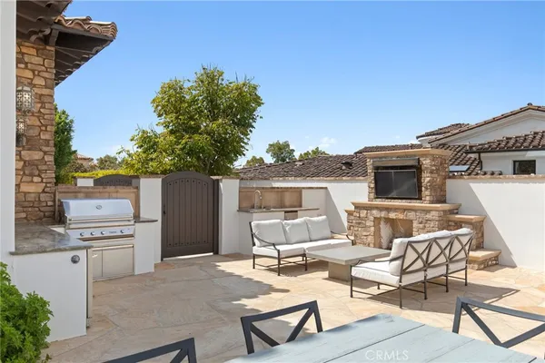 a aerial view of a house with a yard table and chairs
