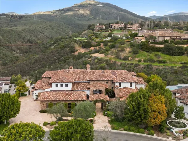 an aerial view of a house with a garden