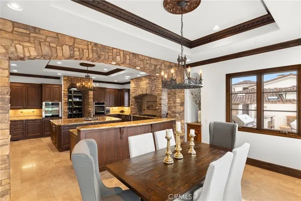 a dining table with chairs and wooden floor