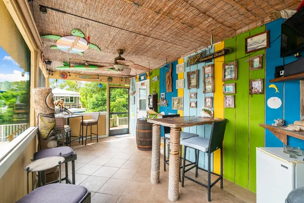 a view of an outdoor dining space with a patio
