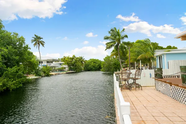 a view of a backyard with sitting area