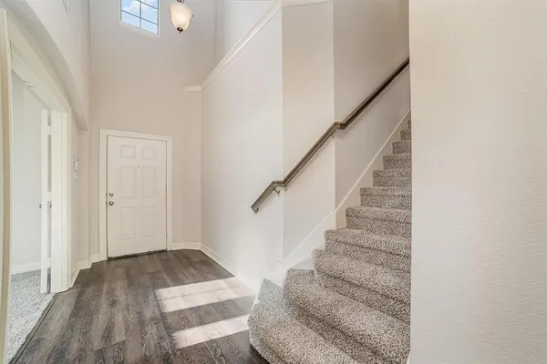 a view of entryway with wooden floor