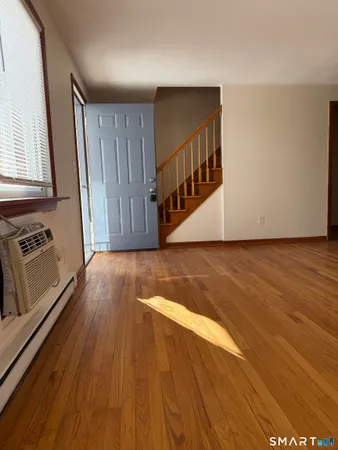 a view of a livingroom with wooden floor