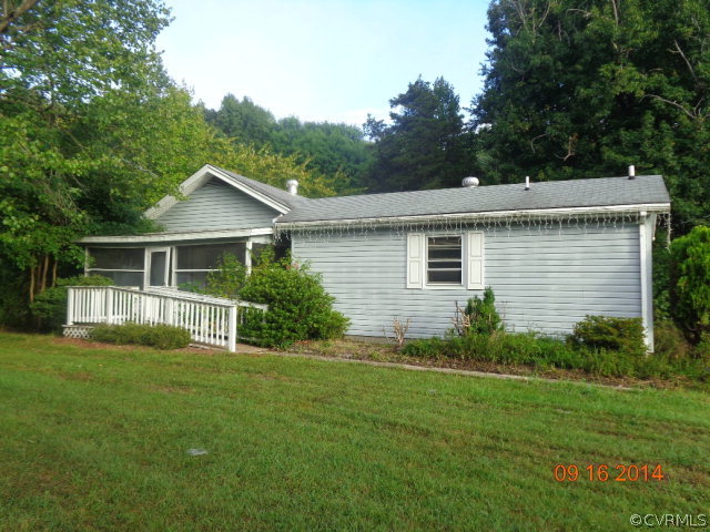 258 Raines Tavern Road Farmville, VA 23901 - Photo 1 of 13 a front view of house with yard and green space