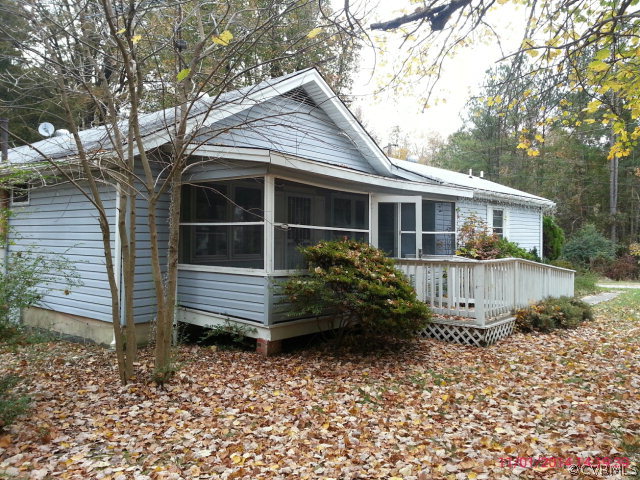 258 Raines Tavern Road Farmville, VA 23901 - Photo 4 of 13 a view of a house with a yard and potted plants