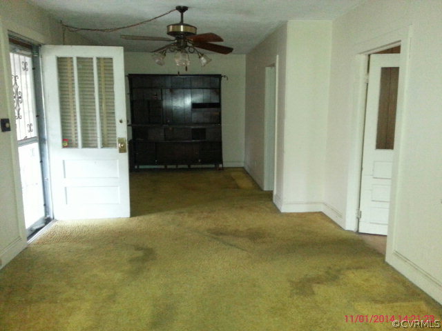 258 Raines Tavern Road Farmville, VA 23901 - Photo 5 of 13 an empty room with windows and cabinet