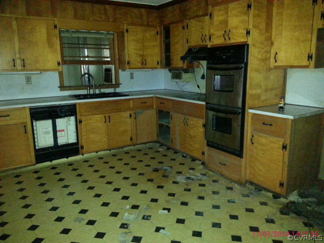 258 Raines Tavern Road Farmville, VA 23901 - Photo 7 of 13 a kitchen with a sink and cabinets