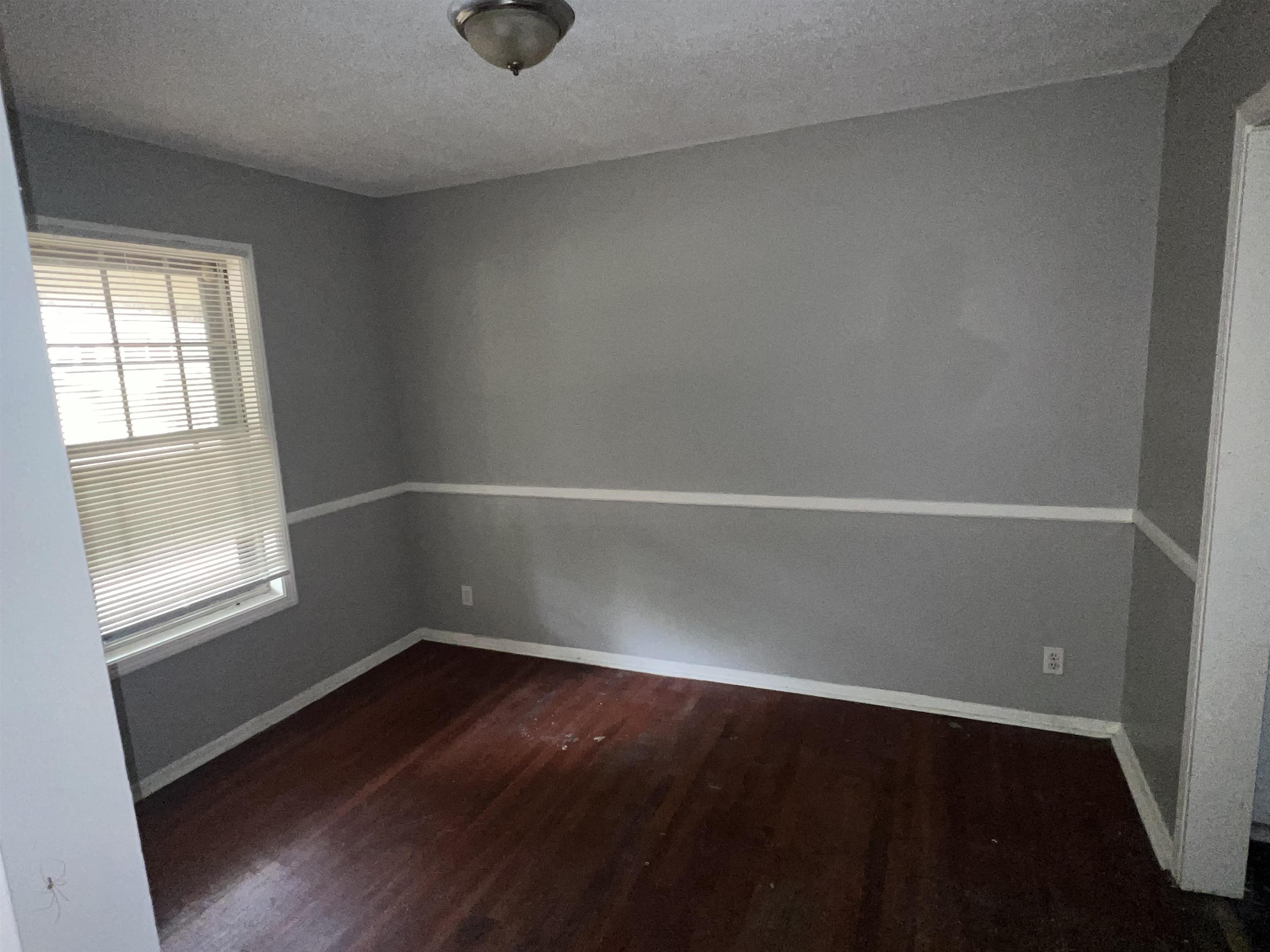 2950 Invergarry Road Memphis, TN 38128 - Photo 14 of 19 Spare room featuring a textured ceiling and hardwood / wood-style flooring