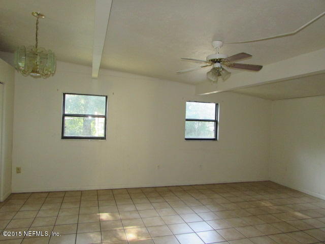 10528 Dodd Road Jacksonville, FL 32218 - Photo 5 of 9 a view of an empty room with a window
