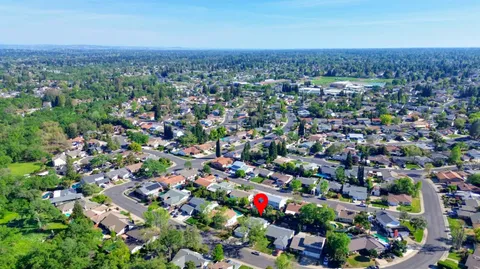 a view of kitchen with stainless steel appliances cabinets and outdoor space