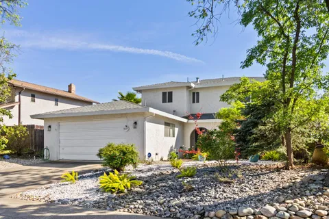 an aerial view of multiple houses with outdoor space