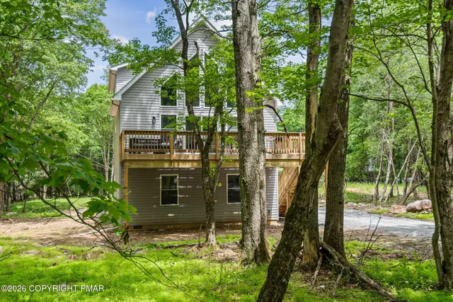 a bathroom with a sink mirror and toilet