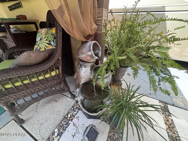 a view of a yard with cars parked