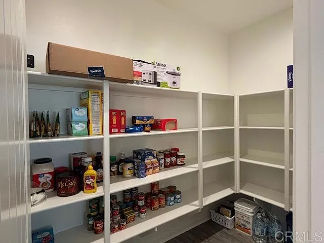 a room with wine cabinets and a wooden floor