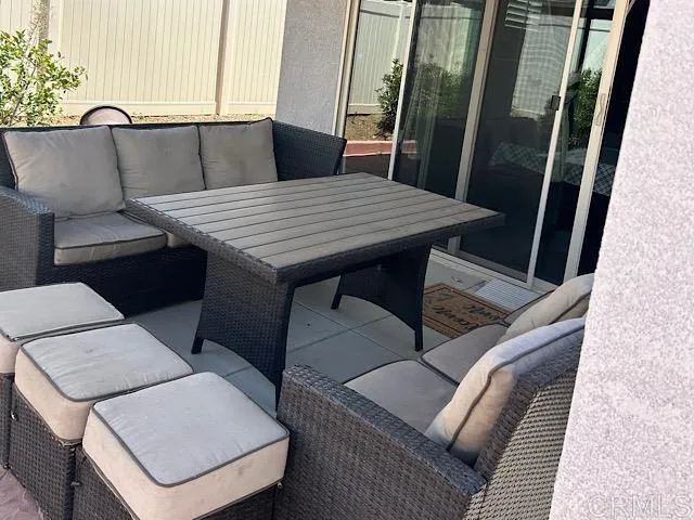 a living room with a couch and a large window