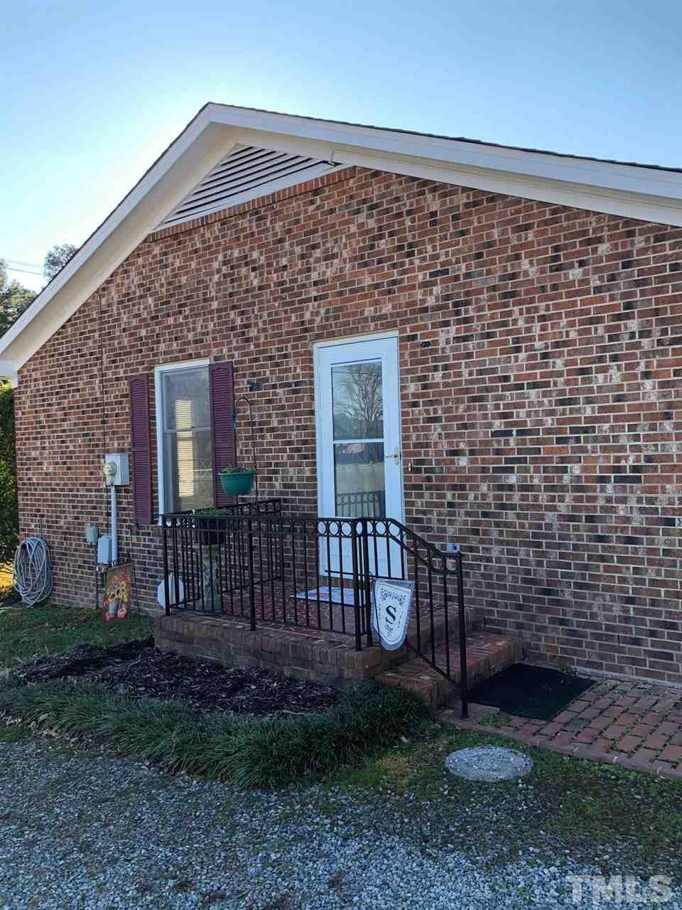 4603 Hopson Road Durham, NC 27703 - Photo 17 of 24 Side entry opens to kitchen and eating area.