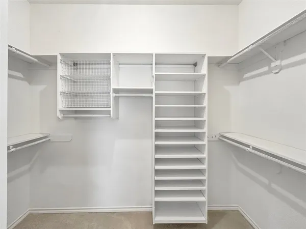 a spacious bathroom with a double vanity sink mirror and double