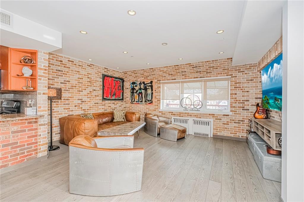 3567 Shore Parkway, Unit H4A Brooklyn, NY 11235 - Photo 5 of 35 a living room with furniture and a large window