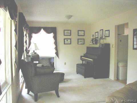 14104 Spring Gate Road Midlothian, VA 23112 - Photo 3 of 5 a living room with furniture and a window