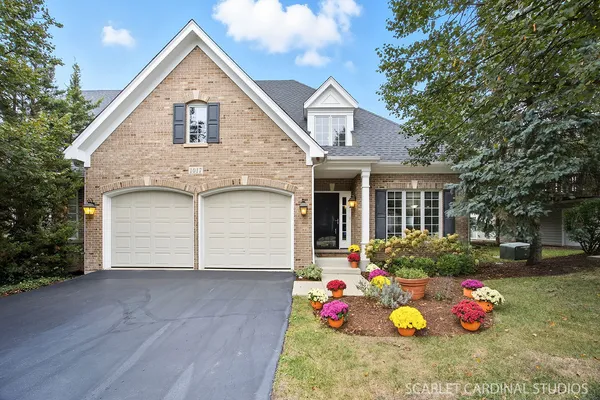 a front view of a house with a garage