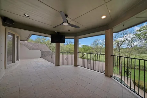 a view of an empty room and a window