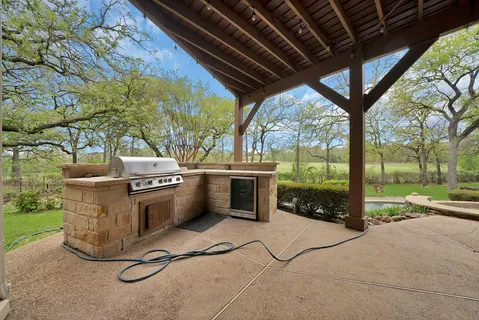 a view of a swimming pool with a yard