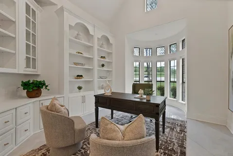 a dining room with furniture and wooden floor