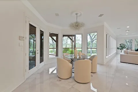 a living room with furniture and windows