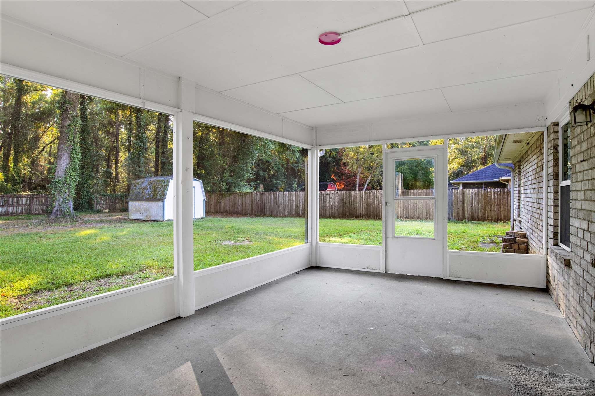 5801 Loring Drive Milton, FL 32583 - Photo 19 of 27 a view of a garden with an outdoor space