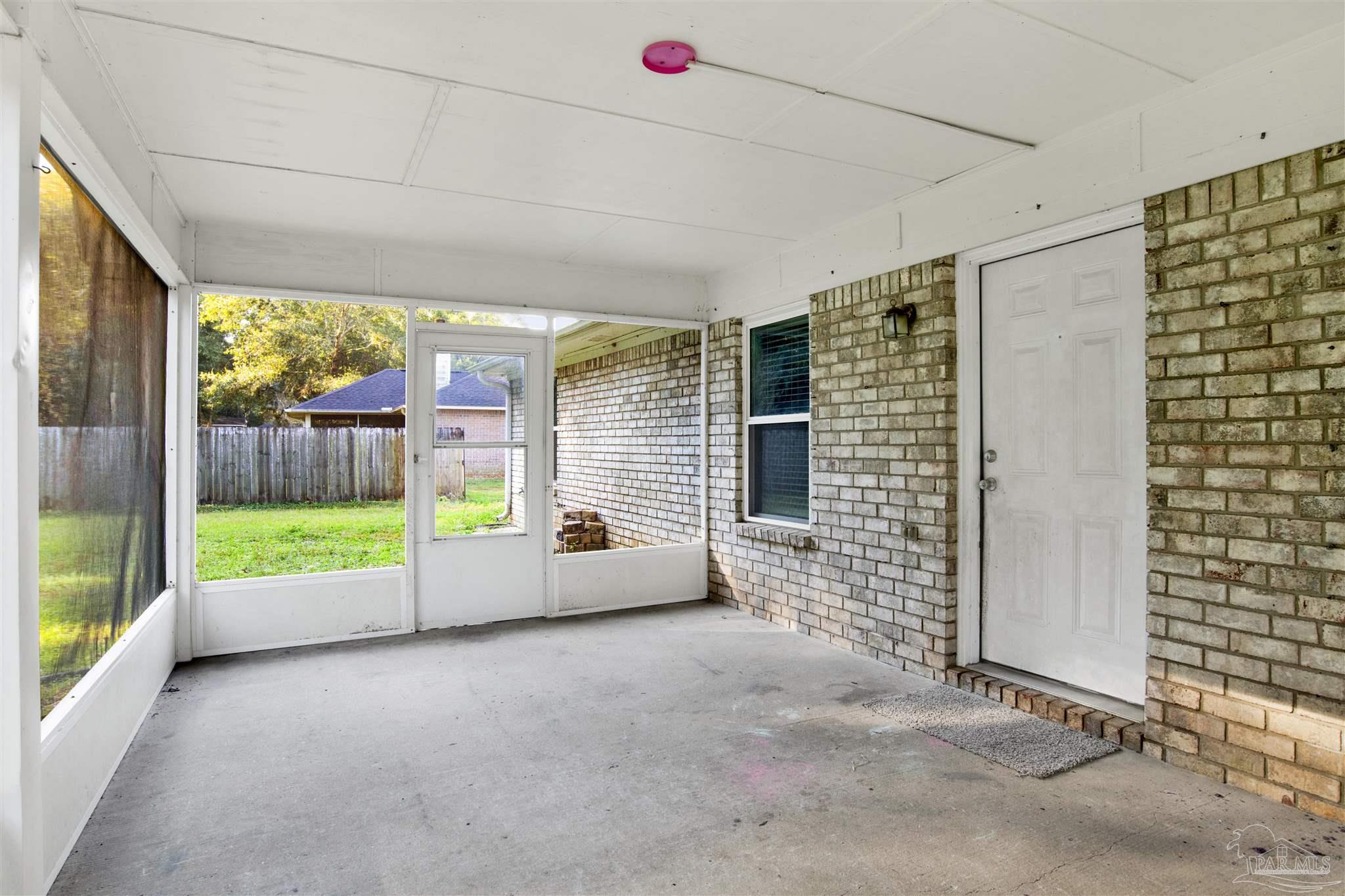 5801 Loring Drive Milton, FL 32583 - Photo 20 of 27 a view of an empty room with a balcony