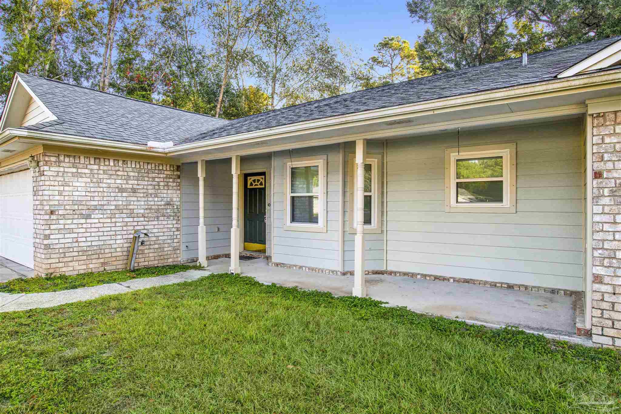 5801 Loring Drive Milton, FL 32583 - Photo 2 of 27 a view of a house with a yard and an outdoor space