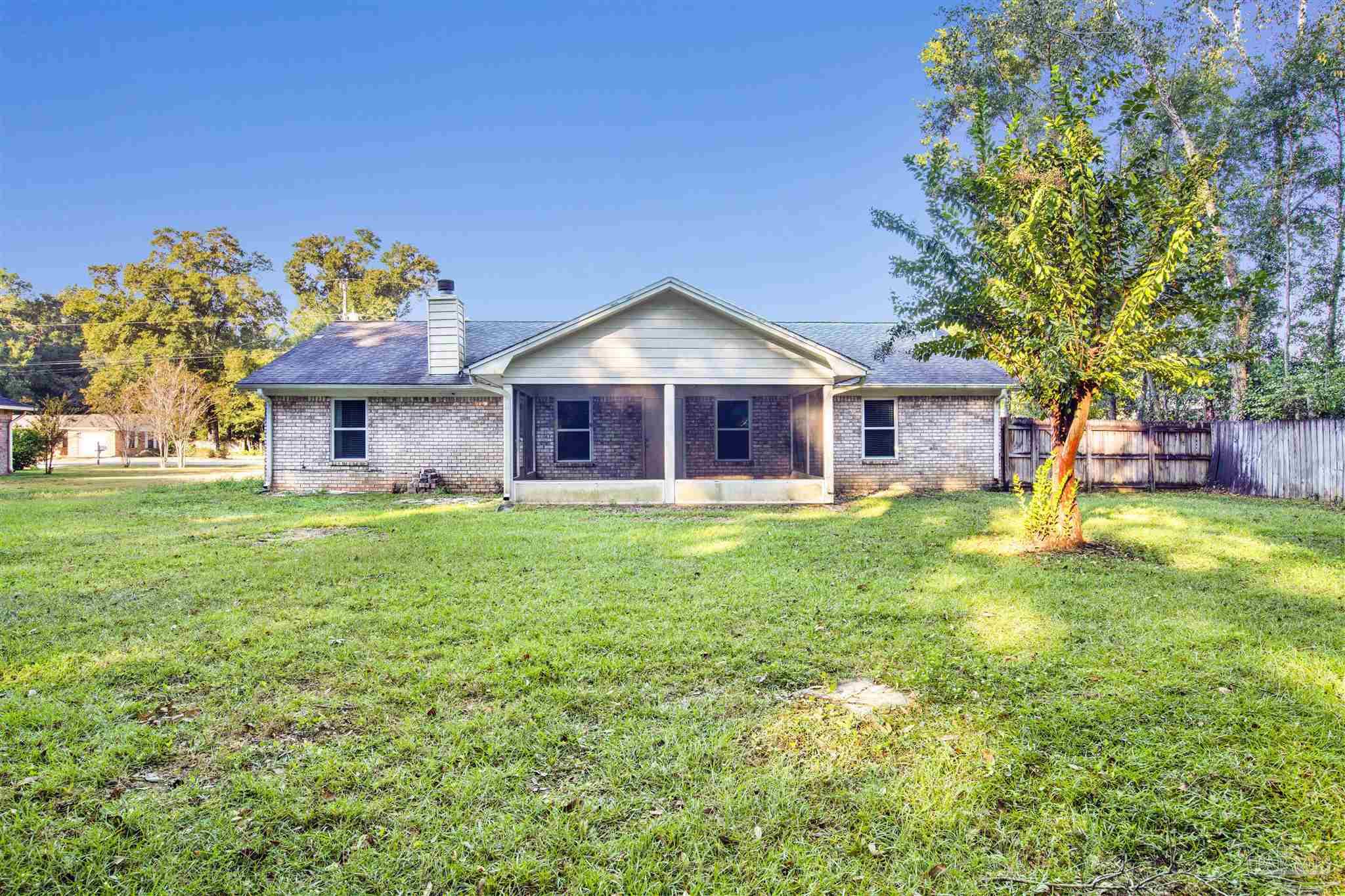 5801 Loring Drive Milton, FL 32583 - Photo 24 of 27 a front view of a house with a yard