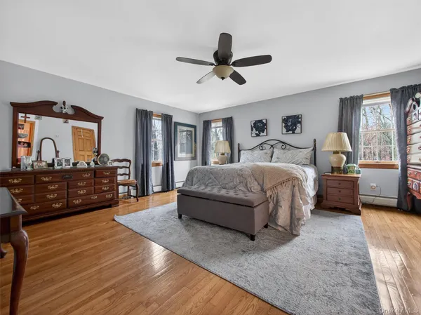 a bedroom with a large bed and a large window