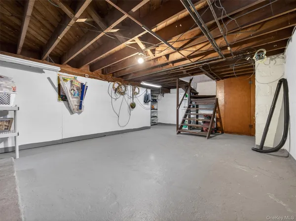 a view of a garage room with wooden walls