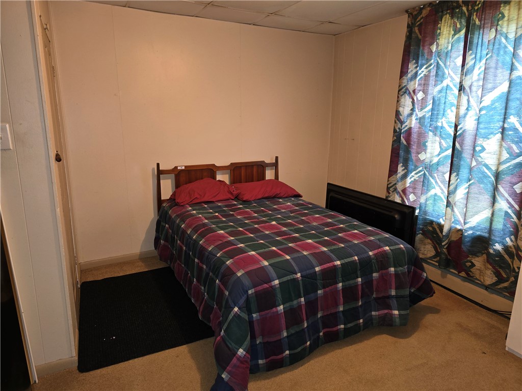 457 Wolf Road West Alexandria, OH 45381 - Photo 17 of 28 This cozy bedroom provides a comfortable retreat with ample space for rest and relaxation.