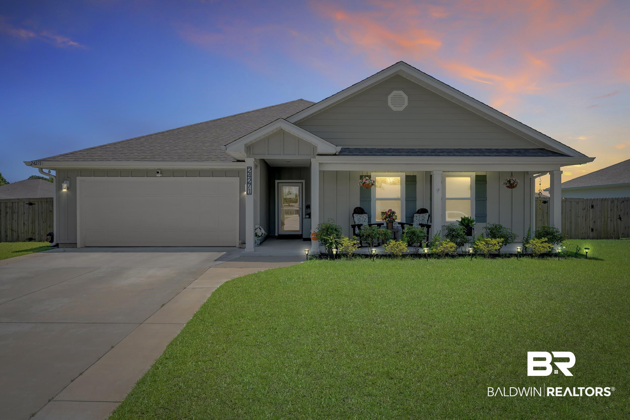 24271 Ringneck Loop Elberta, AL 36530 - Photo 2 of 44 Single-story home featuring a covered front porch with decorative columns, a two-car garage, and a concrete driveway