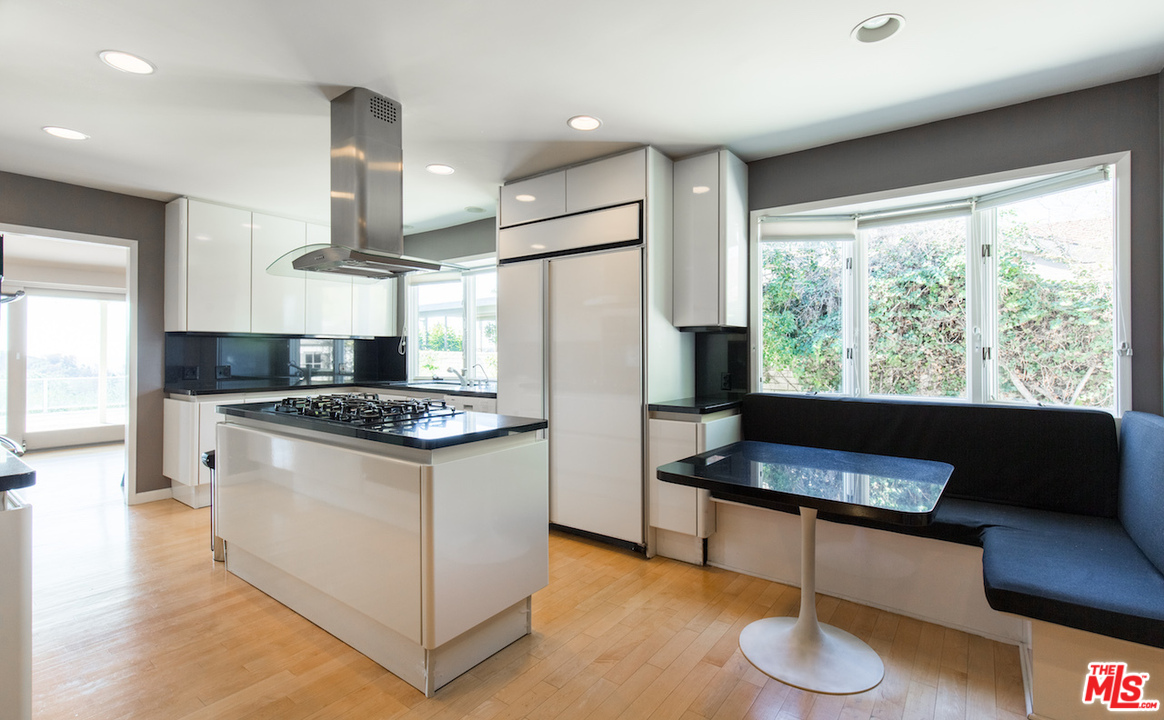 3012 Arrowhead Drive Los Angeles, CA 90068 - Photo 11 of 53 a kitchen with stainless steel appliances granite countertop a sink a stove and a refrigerator