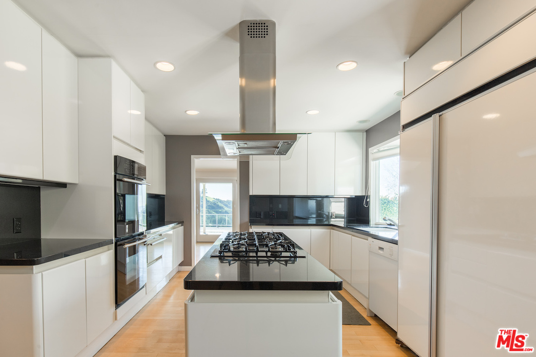 3012 Arrowhead Drive Los Angeles, CA 90068 - Photo 14 of 53 a kitchen with stainless steel appliances granite countertop a sink stove and refrigerator