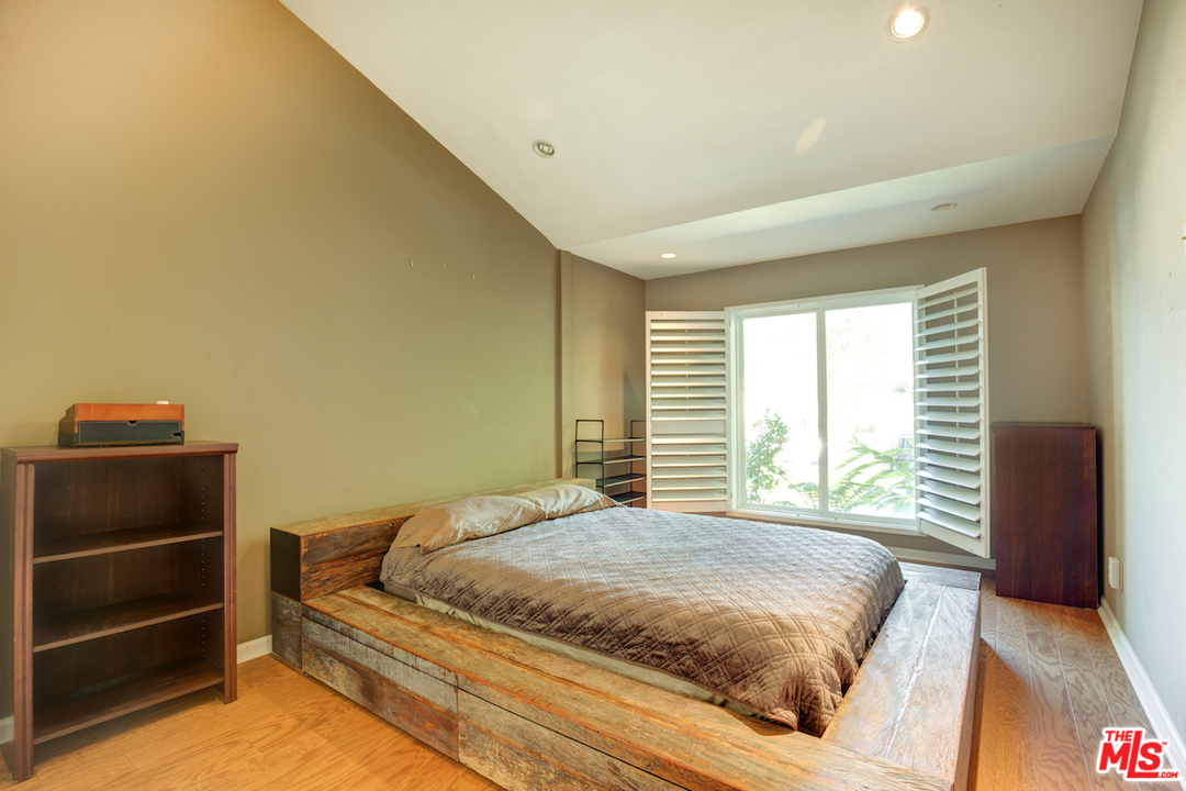 3012 Arrowhead Drive Los Angeles, CA 90068 - Photo 19 of 53 a bedroom with a bed and a window