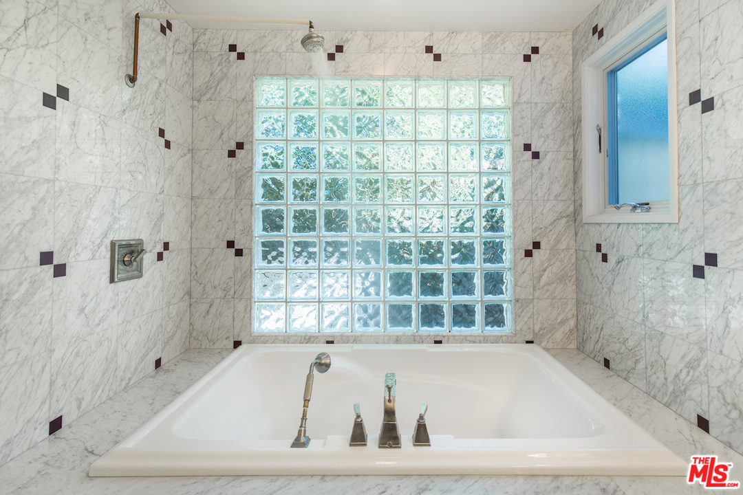 3012 Arrowhead Drive Los Angeles, CA 90068 - Photo 25 of 53 a bathroom with a bathtub and shower