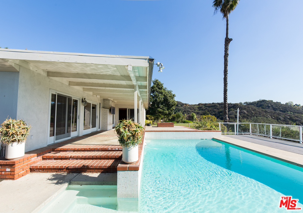 3012 Arrowhead Drive Los Angeles, CA 90068 - Photo 39 of 53 a view of a house with swimming pool and sitting area