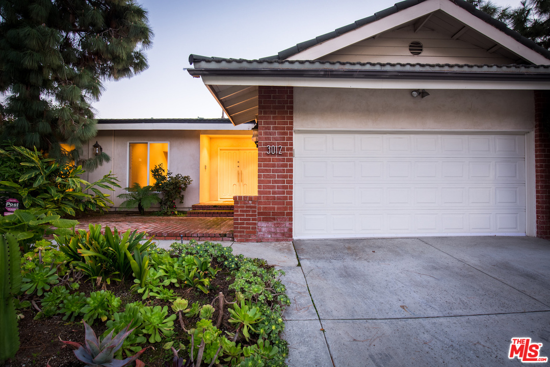3012 Arrowhead Drive Los Angeles, CA 90068 - Photo 48 of 53 a front view of a house with a yard