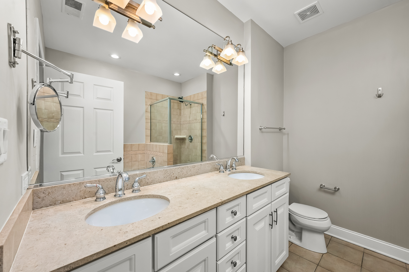 1408 West Taylor Street, Unit 301 Chicago, IL 60607 - Photo 11 of 21 a bathroom with a granite countertop sink a toilet and a mirror