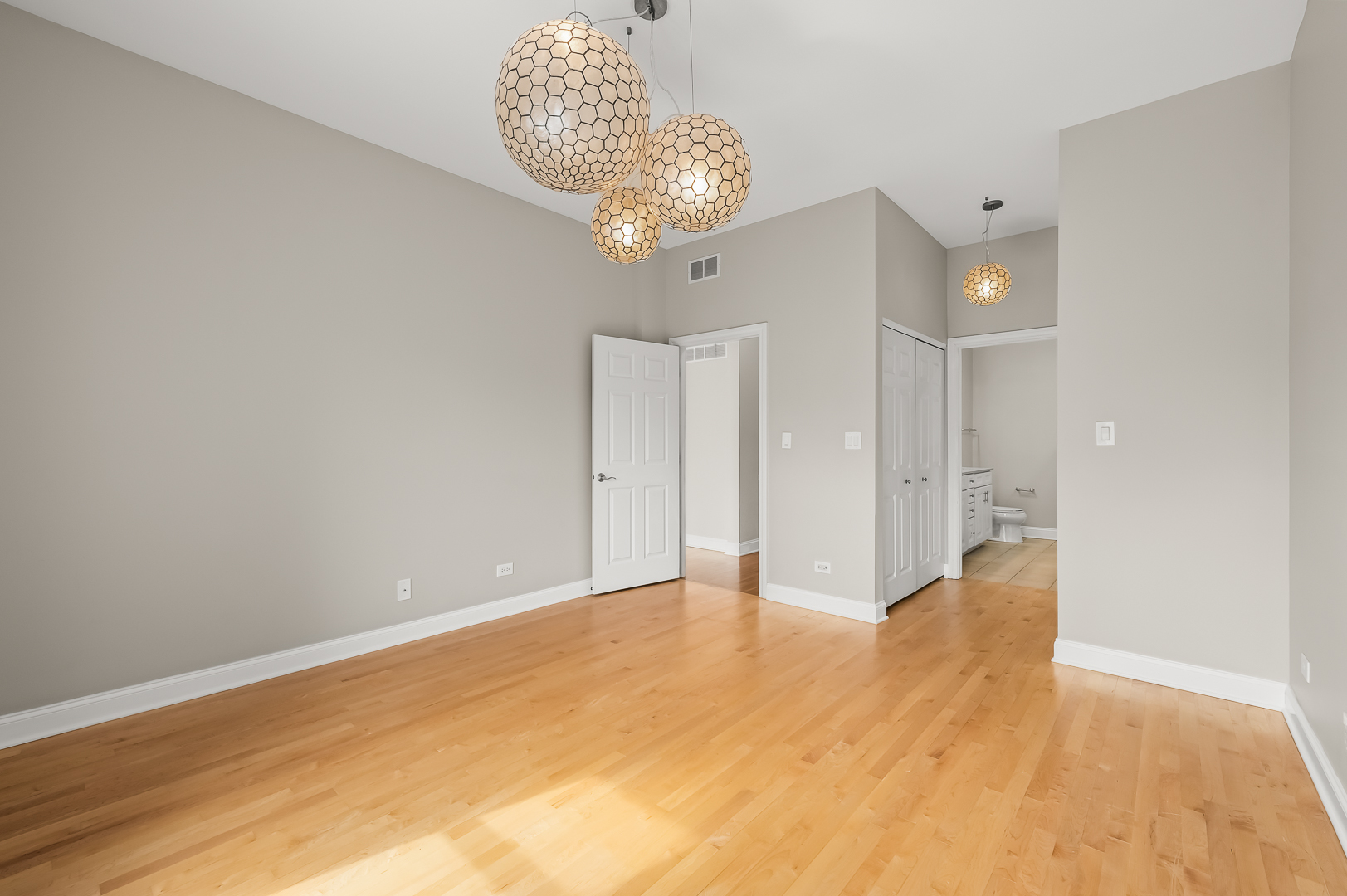 1408 West Taylor Street, Unit 301 Chicago, IL 60607 - Photo 12 of 21 a view of an empty room and chandelier fan