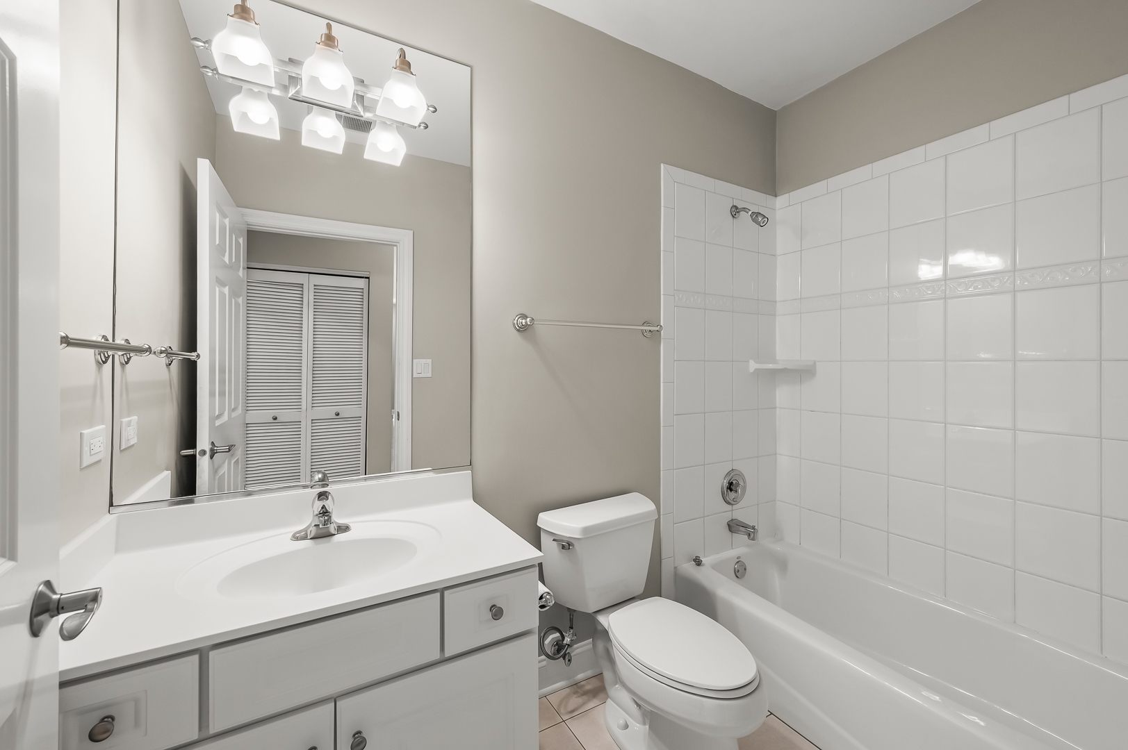1408 West Taylor Street, Unit 301 Chicago, IL 60607 - Photo 16 of 21 a bathroom with a sink a toilet and shower