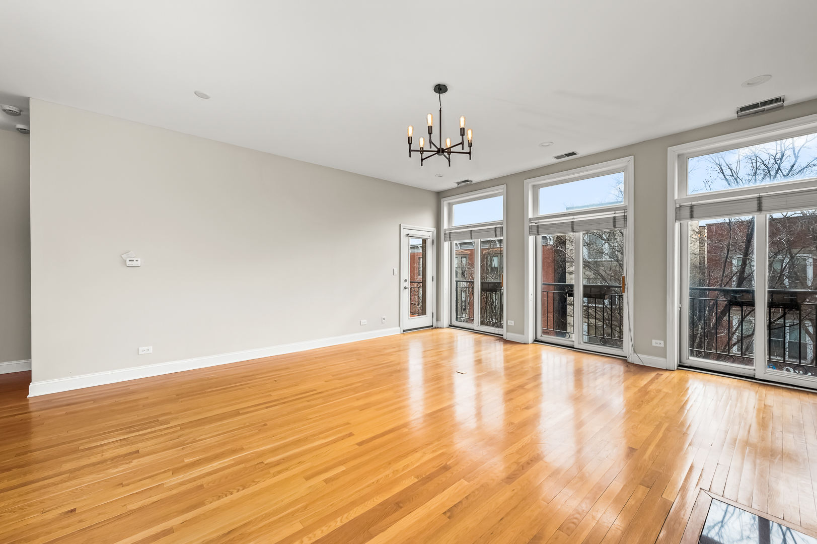 1408 West Taylor Street, Unit 301 Chicago, IL 60607 - Photo 5 of 21 a view of an empty room with glass door