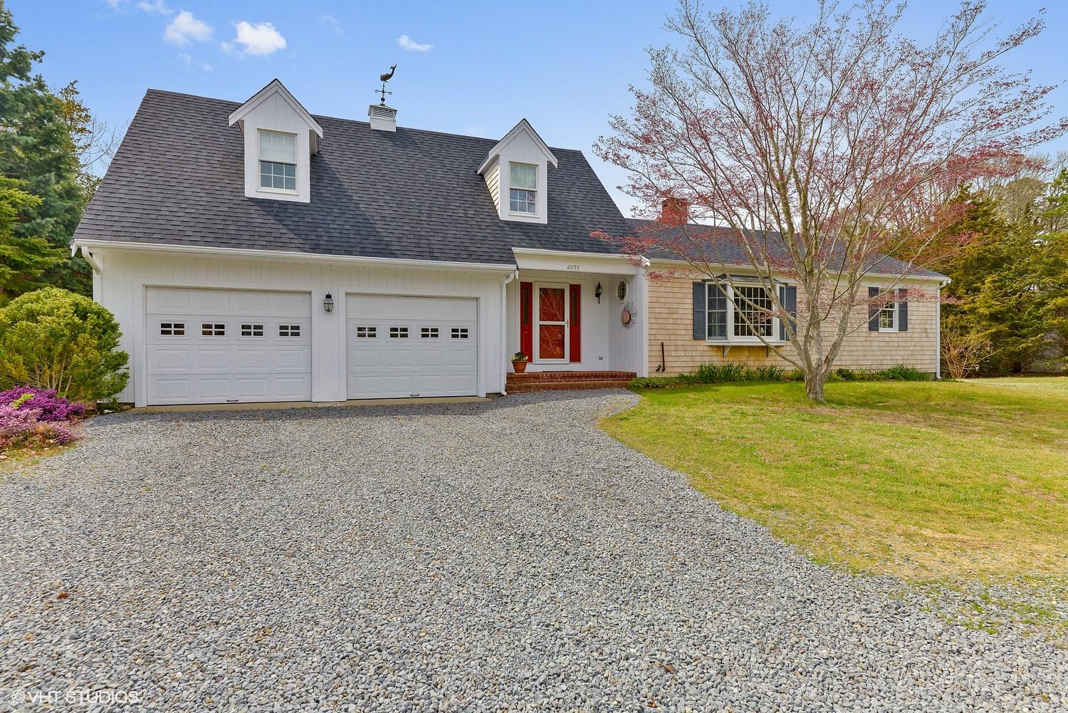 2055 Bridge Road Eastham, MA 02642 - Photo 1 of 22 a front view of a house with garden